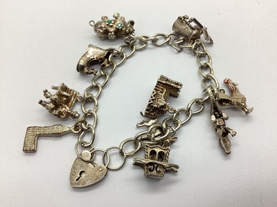 Lot 113 - A Hallmarked Silver Curb Link Charm Bracelet,...