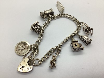 Lot 114 - A Hallmarked Silver Curb Link Charm Bracelet,...