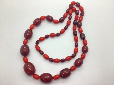 Lot 130 - A Cherry Amber Colour Long Single Strand...