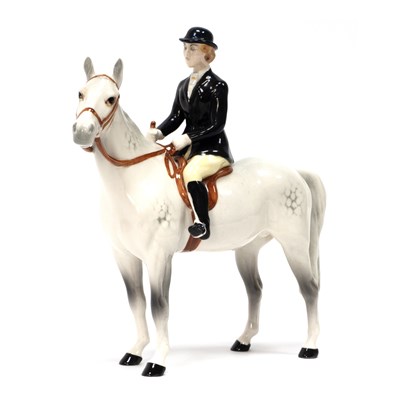 Lot 1242 - A Beswick Pottery Huntswoman, on grey dapple...