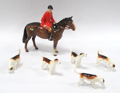 Lot 1206 - A Beswick Pottery Huntsman wearing red...