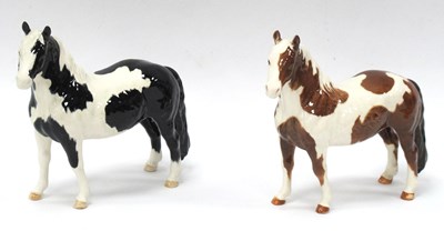 Lot 1203 - A Beswick Pottery Piebald Pinto Pony, together...