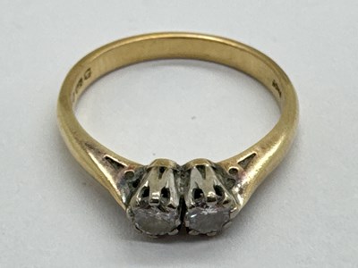 Lot 43 - A 9ct Gold Two Stone Diamond Ring, the round...