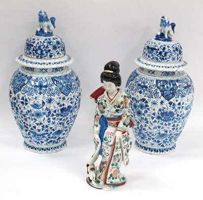 Lot 1333 - A Pair of Oriental Delft Pottery Lidded Jars,...