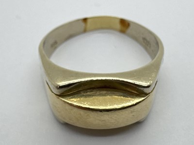 Lot 21 - A Modernist Style Two-Tone Gent's Ring, the...