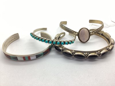 Lot 125 - A Small Collection of Navajo Style Bangles,...