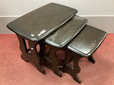 Lot 1559 - Dark Ercol Nest of Tables, with shaped ends,...