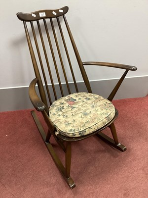 Lot 1561 - Dark Ercol Rocking Chair, (bearing label) with...