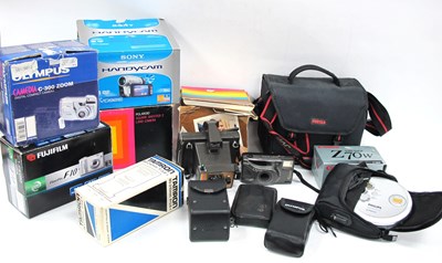 Lot 1441 - Cameras to include two boxed Polaroid examples,...