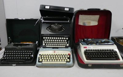 Lot 1127A - Cased typewriters to include silver-reed...