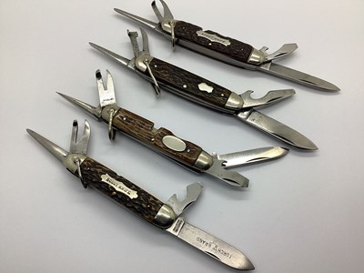 Lot 483 - Multifunction Folding Scout Knives, textured...