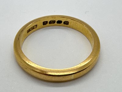 Lot 44 - A 22ct Gold Slim Wedding Band, of plain design...