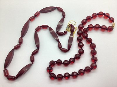 Lot 181 - A Cherry Amber Coloured Beaded Necklace, the...