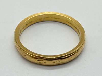 Lot 60 - A 22ct Gold Wedding Band, of textured slim...