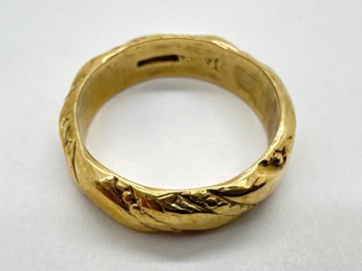 Lot 65 - A 9ct Gold Wedding Band, of allover textured...