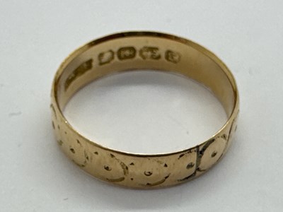 Lot 80 - An 18ct Gold Wedding Band, of allover textured...