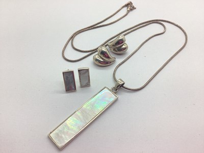 Lot 151 - A Mother of Pearl Inset Elongated Drop Pendant,...