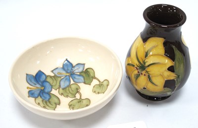 Lot 1226 - Moorcroft Yellow Bermuda Lily Pattern Vase on...