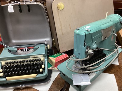 Lot 1522 - Singer Electric Sewing Machine, light blue in...
