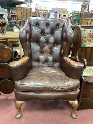 Lot 1573 - Brown Leather Button Back Wing Arm Chair on...