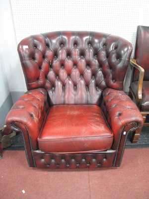 Lot 1493 - Oxblood Button Back Easy Chair with studded...