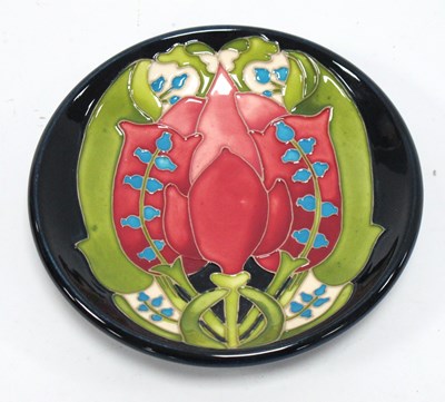 Lot 1291 - A Moorcroft Pottery Coaster, decorated in a...