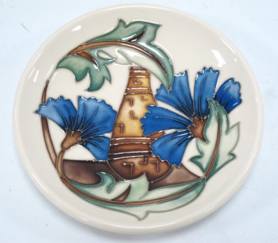 Lot 1296 - A Moorcroft Pottery Coaster, decorated in the '...