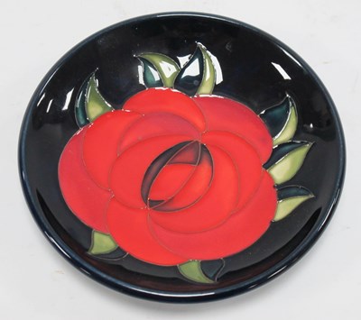 Lot 1297 - A Moorcroft Pottery Coaster, decorated in the '...