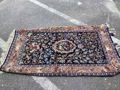 Lot 1555 - Iranian Silk Tassled Rug, tightly knotted,...
