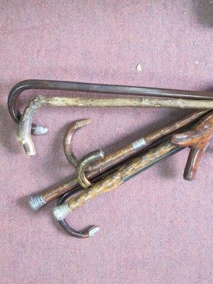 Lot 1143 - A quantity of walking sticks to include one...