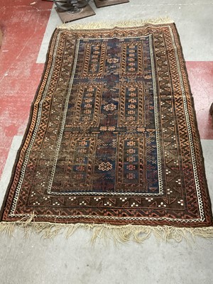 Lot 1575 - A carpet decorated with geometric motifs on a...