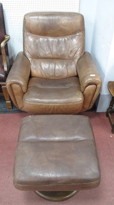 Lot 1495 - A Tan Leather Reclining Armchair, on a...