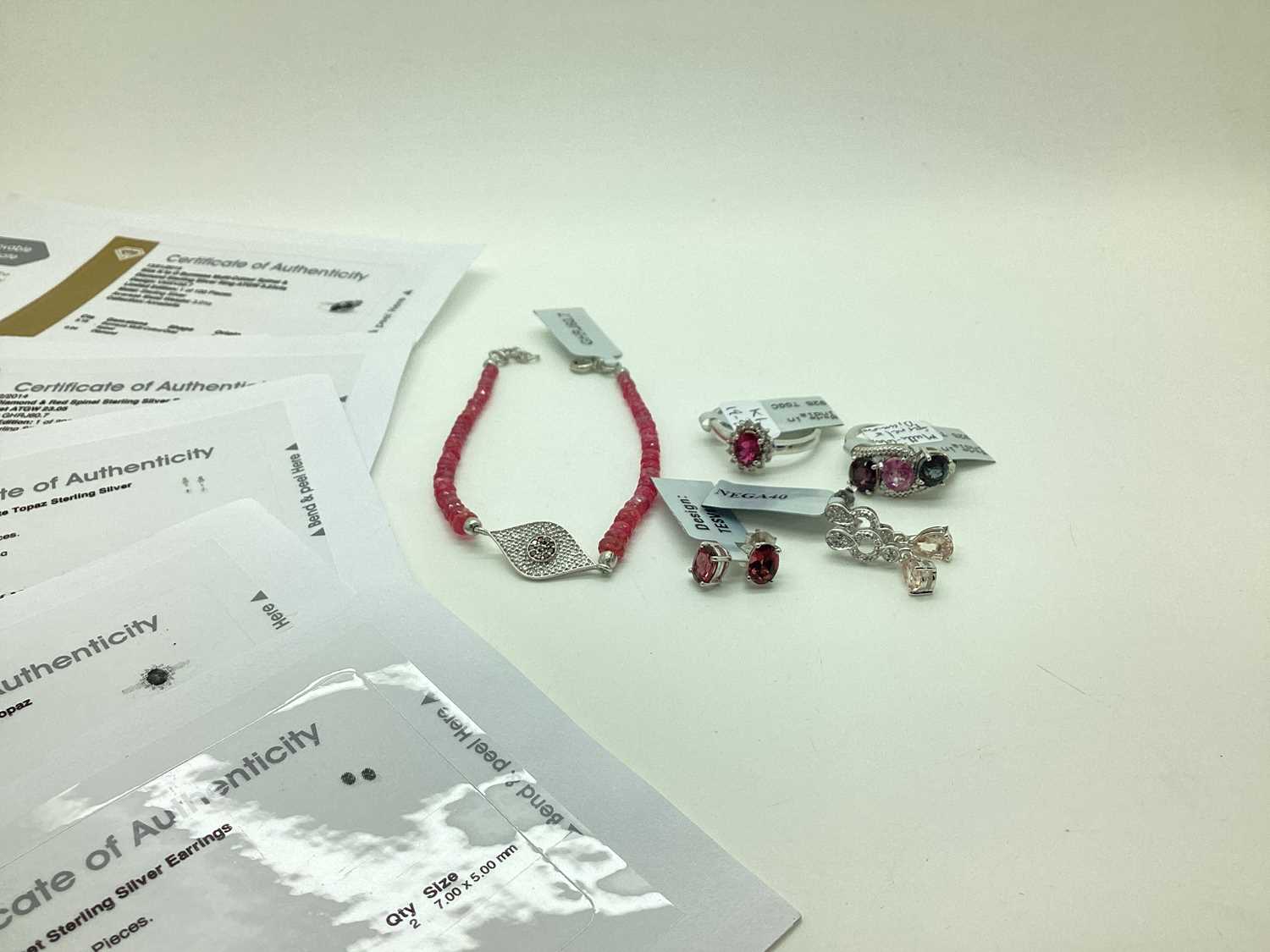 Lot 125 - The Genuine Gemstone Company Ltd; A Modern Red...