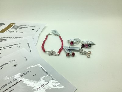 Lot 125 - The Genuine Gemstone Company Ltd; A Modern Red...