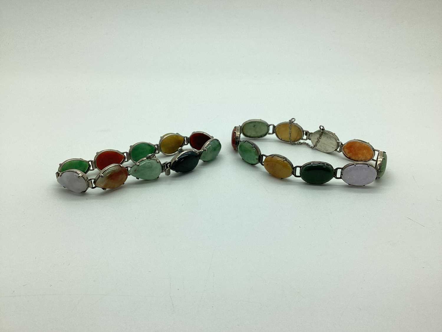 Lot 186 - Two Polished Hardstone Set Bracelets, oval and...