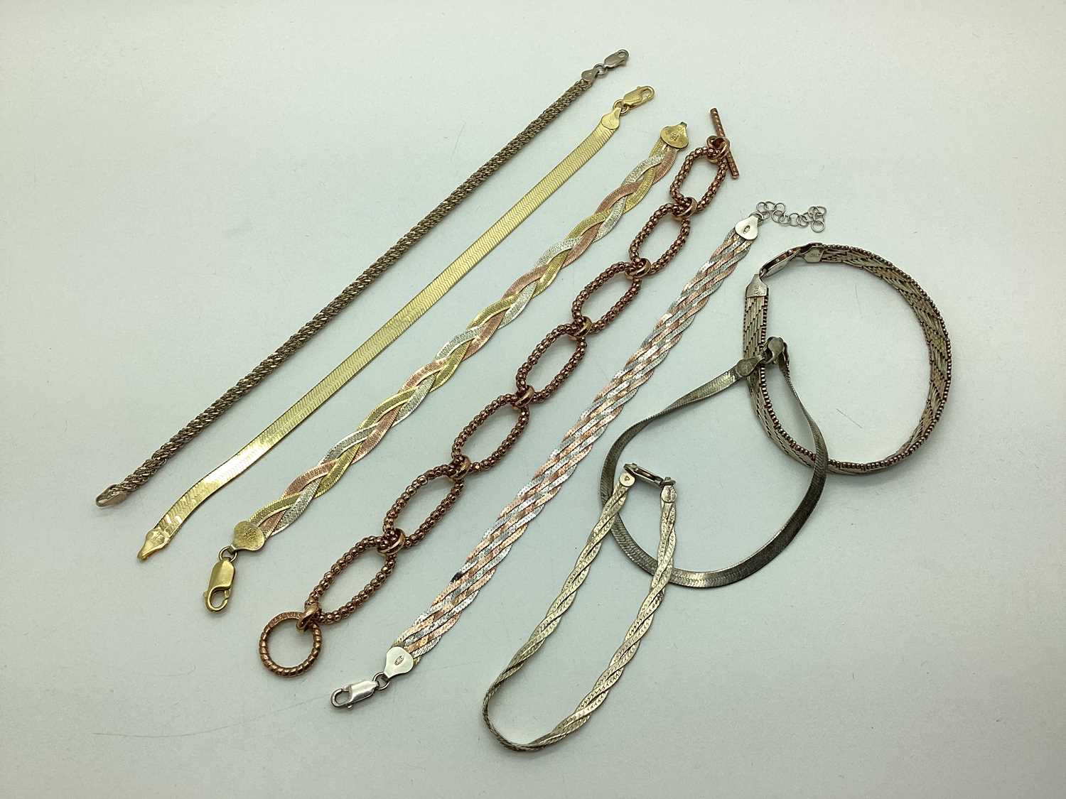 Lot 178 - "925" Gilt and Rose Plated Bracelets,...