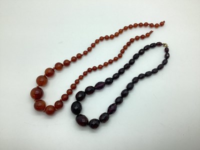 Lot 129 - A Cherry Amber Coloured Graduated Single...