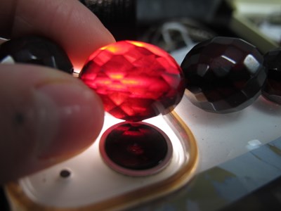 Lot 129 - A Cherry Amber Coloured Graduated Single...