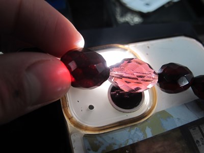 Lot 129 - A Cherry Amber Coloured Graduated Single...