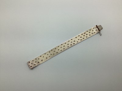 Lot 192 - A Wide Smooth Link Bracelet, of satin and...