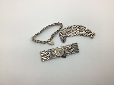 Lot 179 - A Wide Gate Link Style Bracelet, with George...