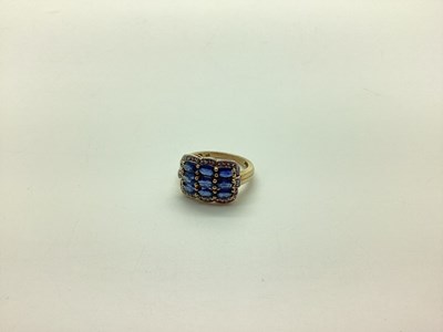 Lot 245 - A Modern Sapphire Set Dress Ring, oval claw...