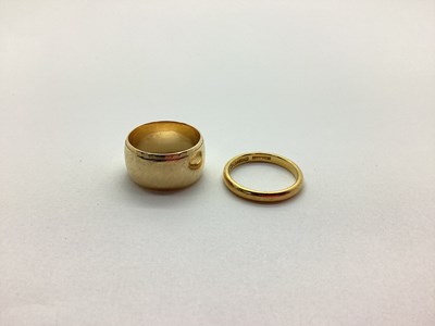 Lot 239 - A 22ct Gold Wedding Band, together with a wide...
