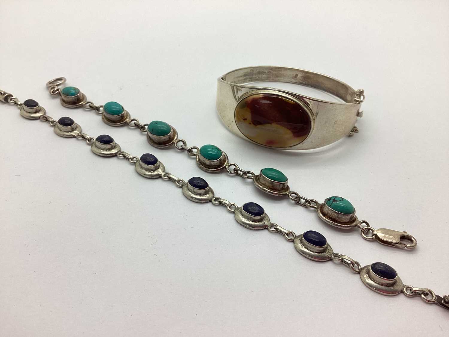 Lot 177 - A Stone Set Hinged Bangle, in a minimalist...