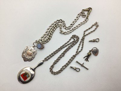 Lot 215 - A Graduated Curb Link Albert Chain, suspending...
