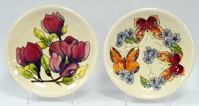 Lot 1063 - Two Moorcroft Pottery Plates, painted in the...