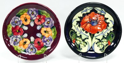 Lot 1057 - A Moorcroft Pottery Plate, of circular form...