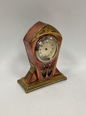Lot 1555 - An Art Nouveau Copper and Brass Mantle Clock,...