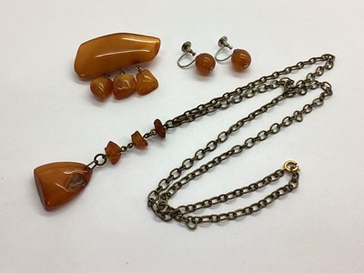 Lot 129 - A Vintage Amber Drop Pendant, on chain; a...