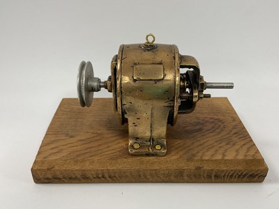 Lot 849 - An early brass cast Stuart four volt generator...